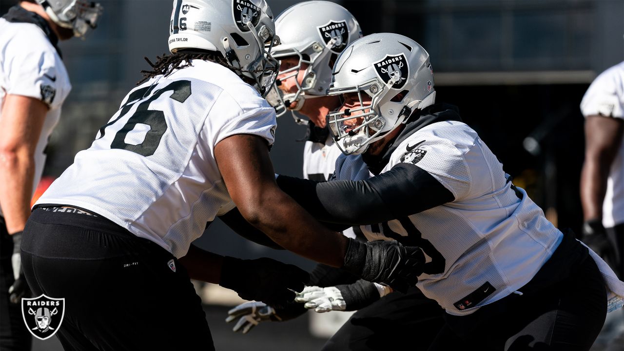 Las Vegas Raiders offensive guard John Simpson (76, left) and offensive  tackle Andre James (68) …