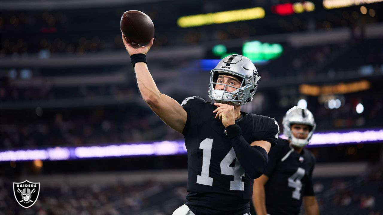 Las Vegas Raiders quarterback Chase Garbers (14) prepares to throw