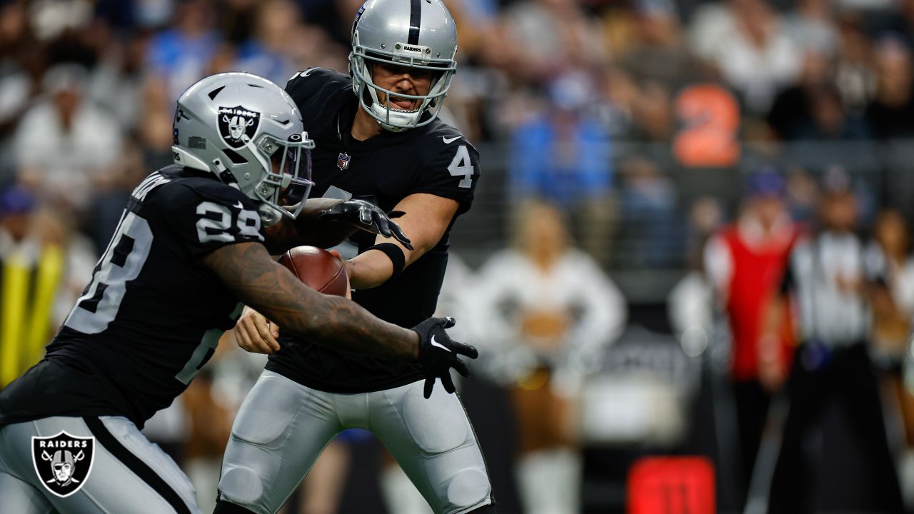 Las Vegas Raiders running back Josh Jacobs (28) gains yards on a run during  an NFL football game against the Los Angeles Chargers, Sunday, September  11, 2022 in Inglewood, Calif. The Chargers