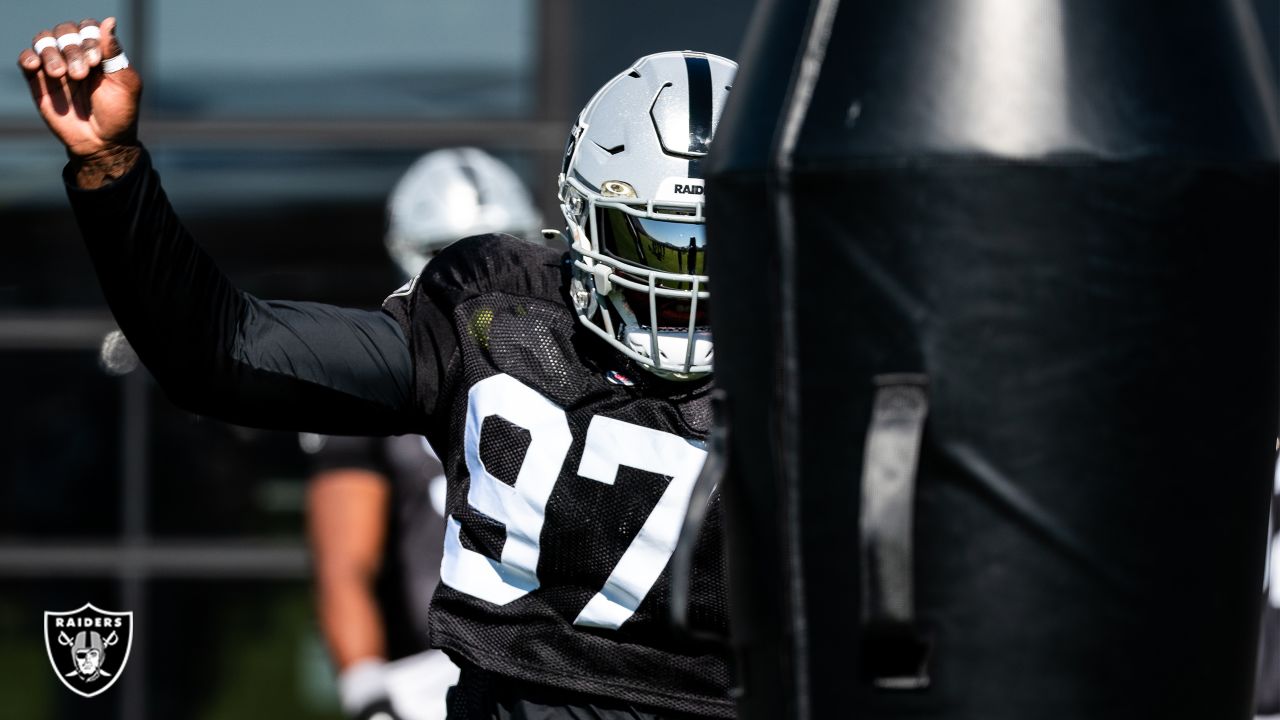 Las Vegas Raiders defensive tackle Maliek Collins (97) stretches