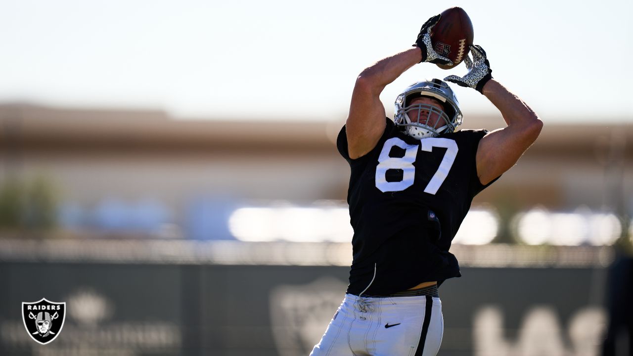 Raiders tight end Foster Moreau (87) is tackled by Raiders linebacker Javin  White (53) during a …