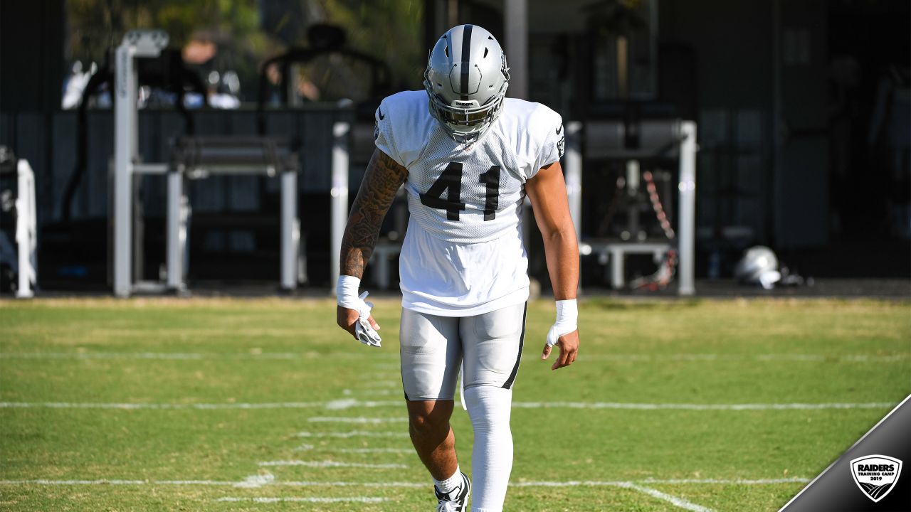 Oakland Raiders offensive guard Jordan Devey (65), center Richie Incognito  (64), and offensive …