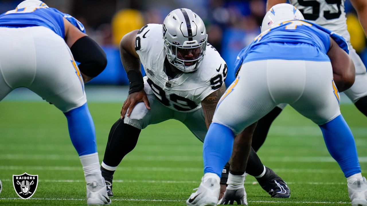 Las Vegas Raiders guard Dylan Parham (66) walks off the field after an  injury with head coach Josh McDaniels, left, during the first half of an NFL  preseason football game against the