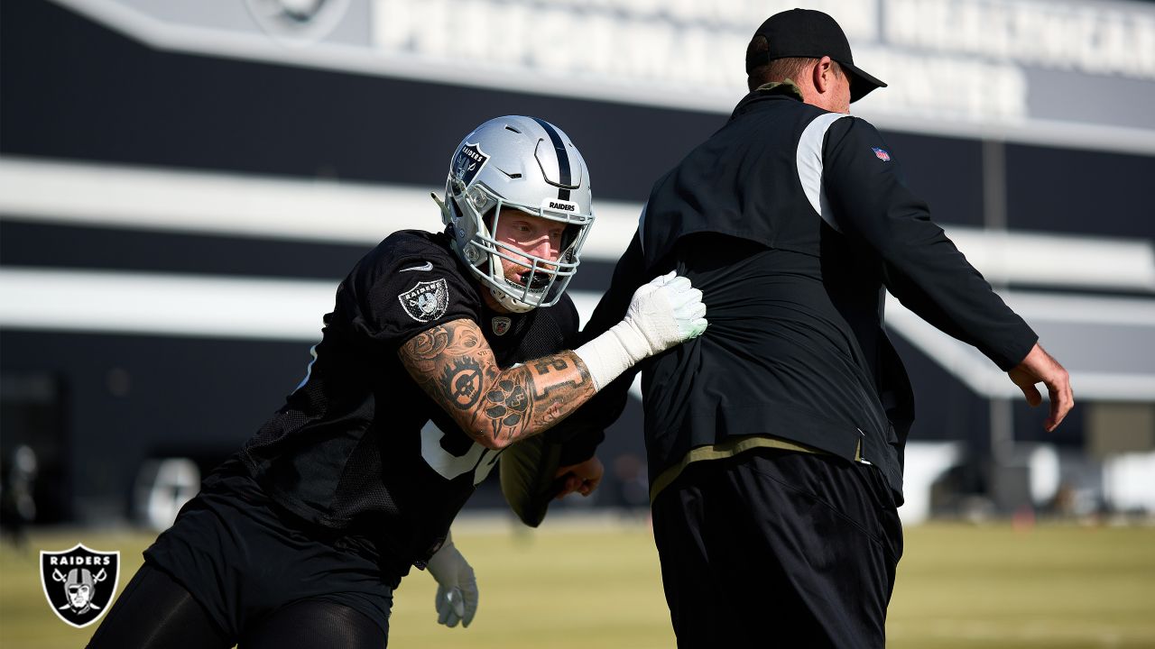 Oakland Raiders defensive end Maxx Crosby (98) gestures after being  penalized for roughing the …