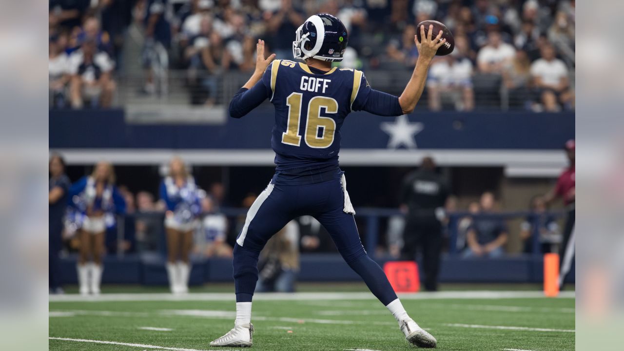 Los Angeles Rams quarterback Jared Goff (16) off balance after