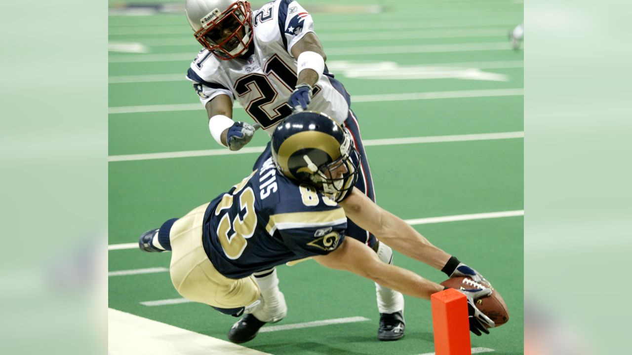 St. Louis' Rams Kevin Curtis (83) reaches for the end zone in his attempt to score a touchdown pass from quarterback Marc Bulger in the fourth quarter against the New England Patriots' Randall Gay (21) in their NFL game in St. Louis Sunday, Nov. 7, 2004. The Patriots challeged the touchdown and the score was called back. The Patriots defeated the Rams by the final score of 40-22. (AP Photo/James A. Finley)