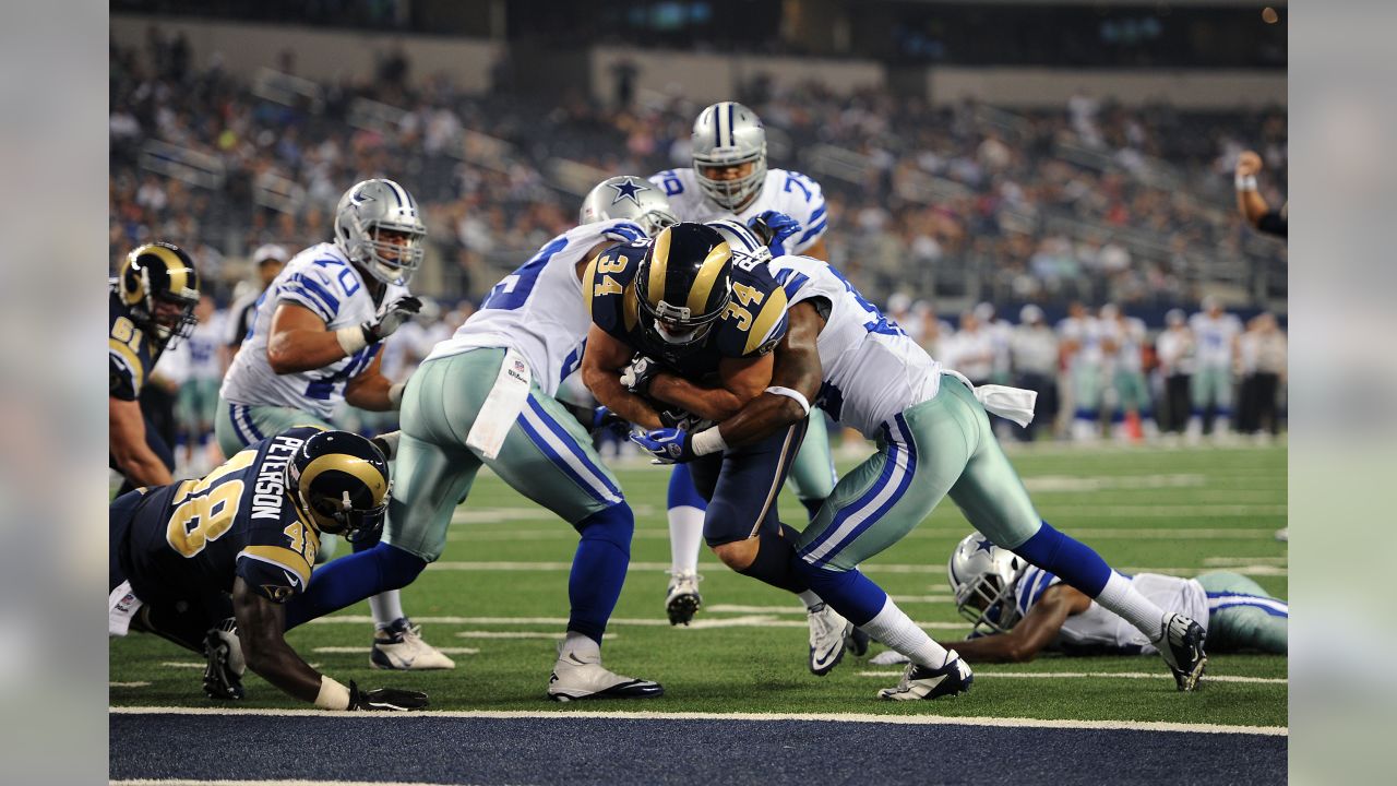 Los Angeles Rams running back Todd Gurley scores past Dallas Cowboys  cornerback Chidobe Awuzie during the first half in an NFL divisional  football playoff game Saturday, Jan. 12, 2019, in Los Ange …