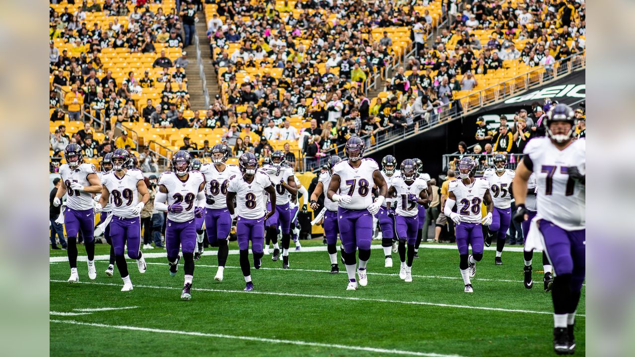 The Pittsburgh Steelers flag corps leads the team on to the field before an  NFL football game against the Baltimore Ravens, Sunday, Dec. 10, 2017, in  Pittsburgh. (AP Photo/Keith Srakocic Stock Photo 