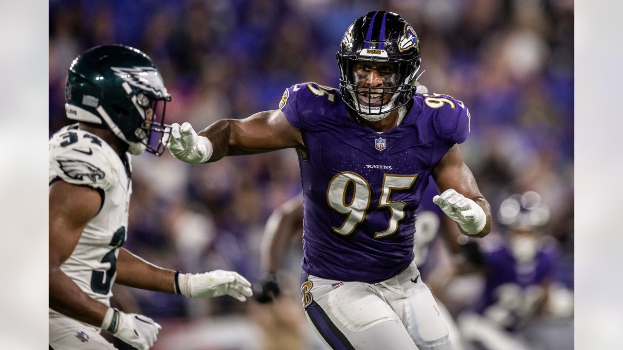 Baltimore Ravens linebacker Tavius Robinson (95) runs during an