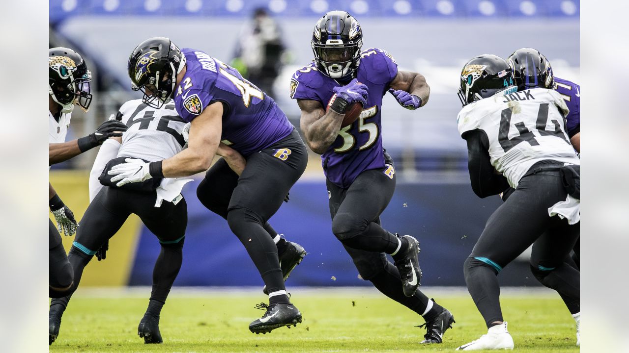 Baltimore Ravens long snapper Nick Moore (46) runs up the field