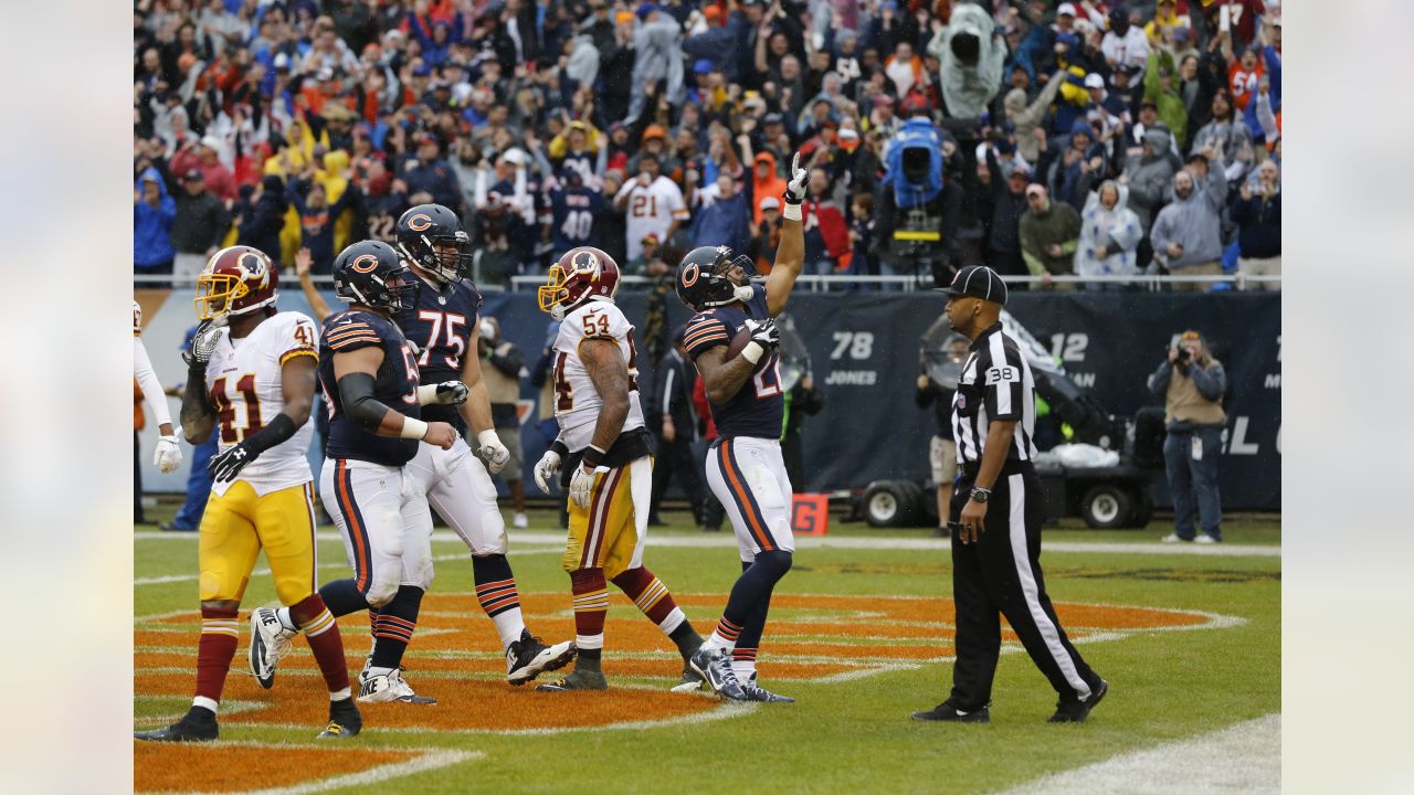 Chicago Bears Matt Forte (centre) celebrates running in the first