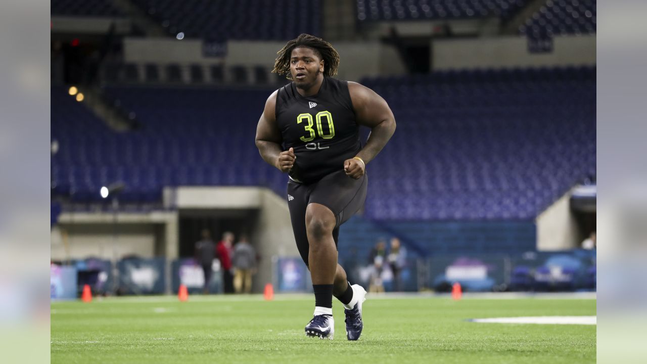 Utah defensive lineman John Penisini runs a drill at the NFL