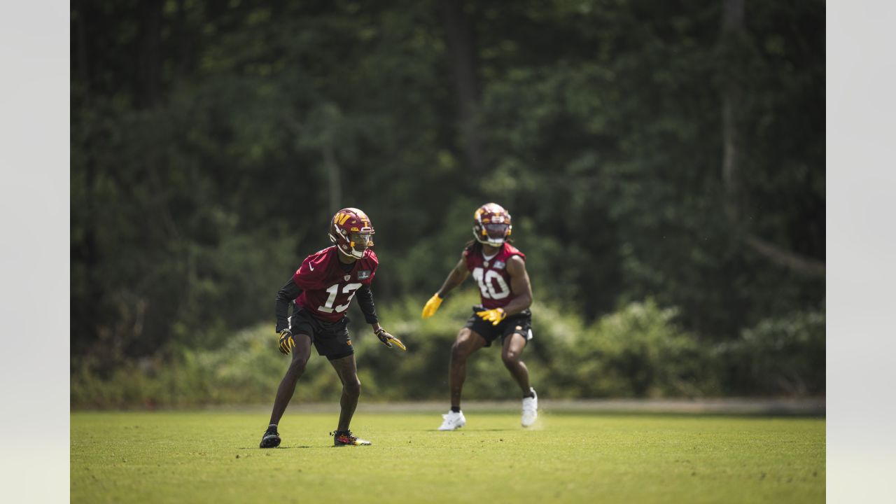 KJ Henry's dad couldn't wait to throw on his Redskins gear after