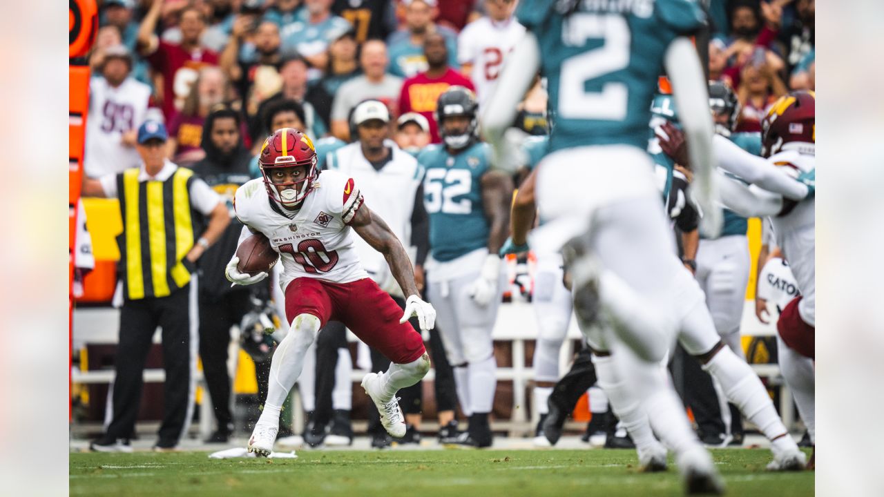 Washington Commanders tight end Armani Rogers (88) wears Crucial