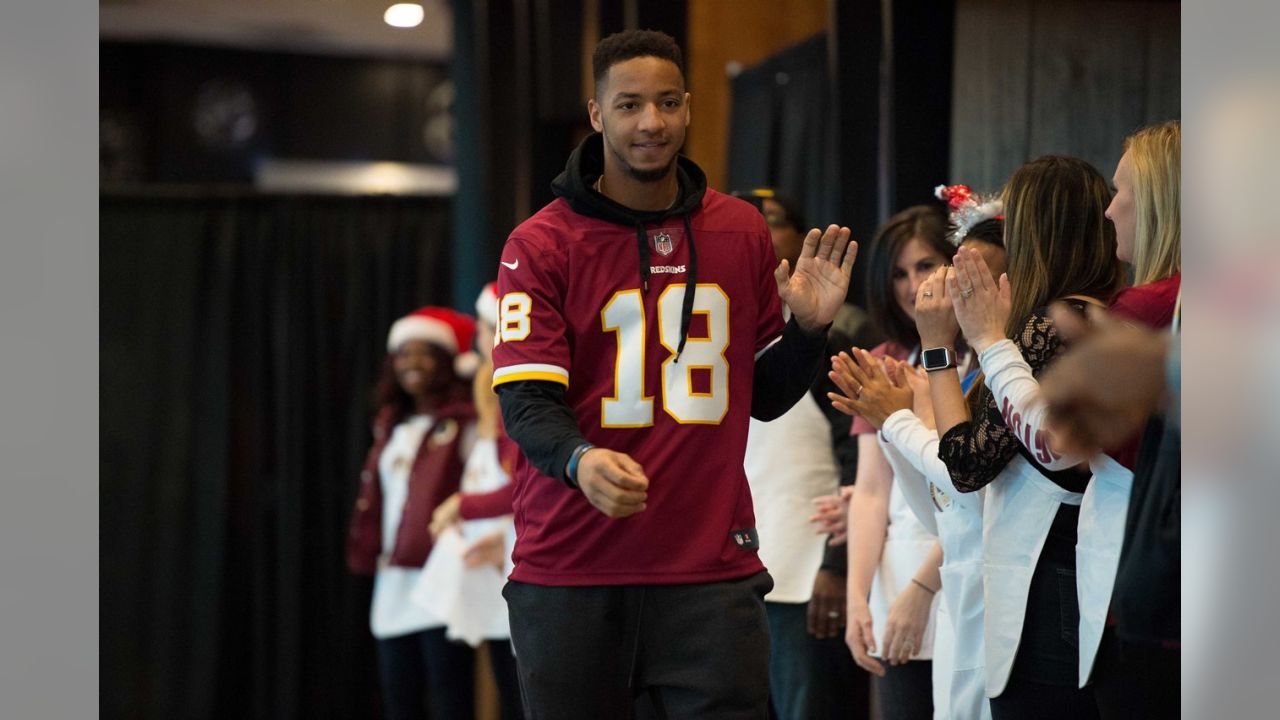 Redskins fans known as the 'Hogfarmers' help youth