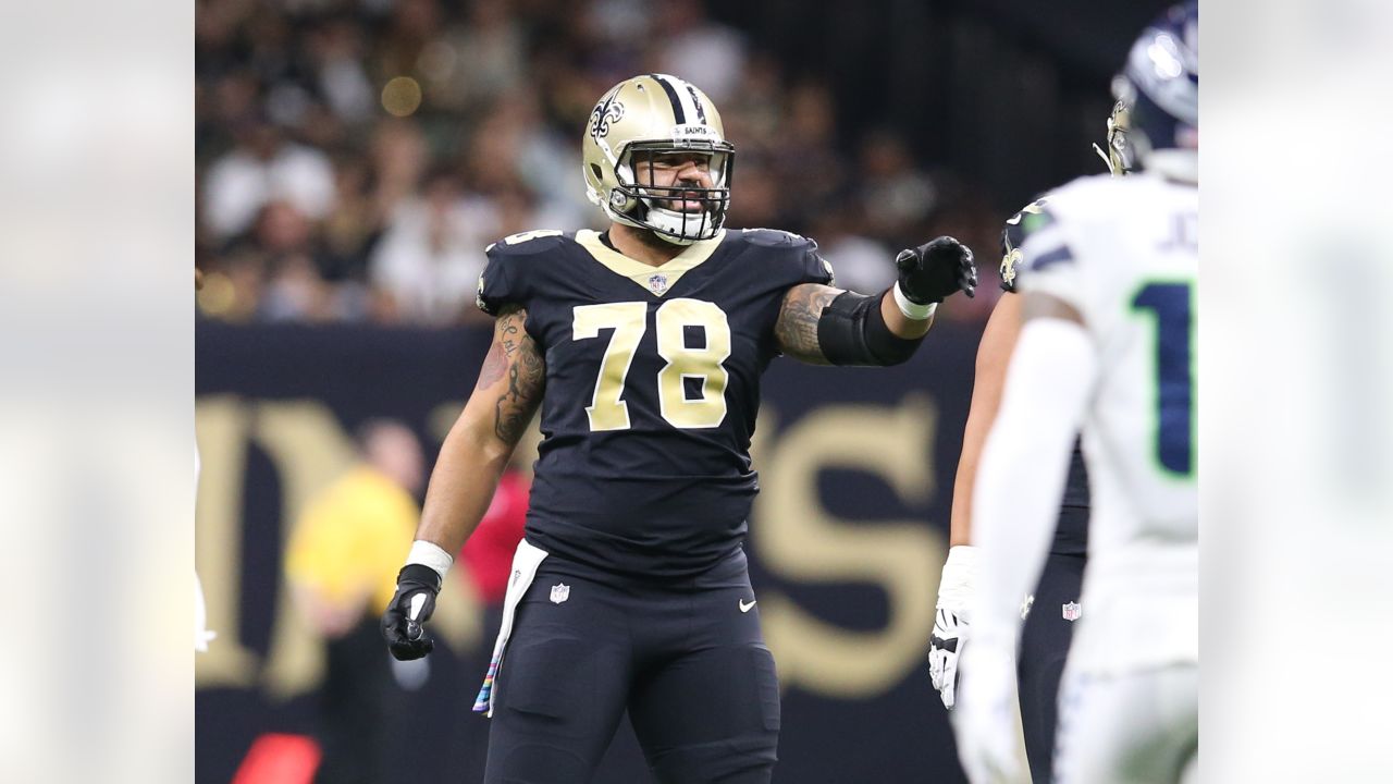 The referee performs the coin toss before an NFL football game between the  New Orleans Saints and the Seattle Seahawks in New Orleans, Sunday, Oct. 9,  2022. The Saints won 39-32. (AP