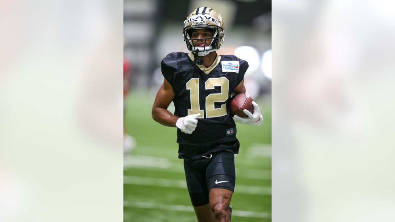 New Orleans Saints wide receiver Chris Olave (12) signs autographs, after  training camp at their NFL football training facility in Metairie, La.,  Saturday, July 30, 2022. (AP Photo/Gerald Herbert Stock Photo - Alamy