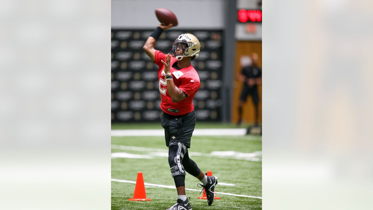 New Orleans Saints first round draft pick, wide receiver Chris Olave (12),  high fives quarterback Jameis Winston (2) during an NFL football practice  in Metairie, La., Thursday, June 2, 2022. (AP Photo/Gerald