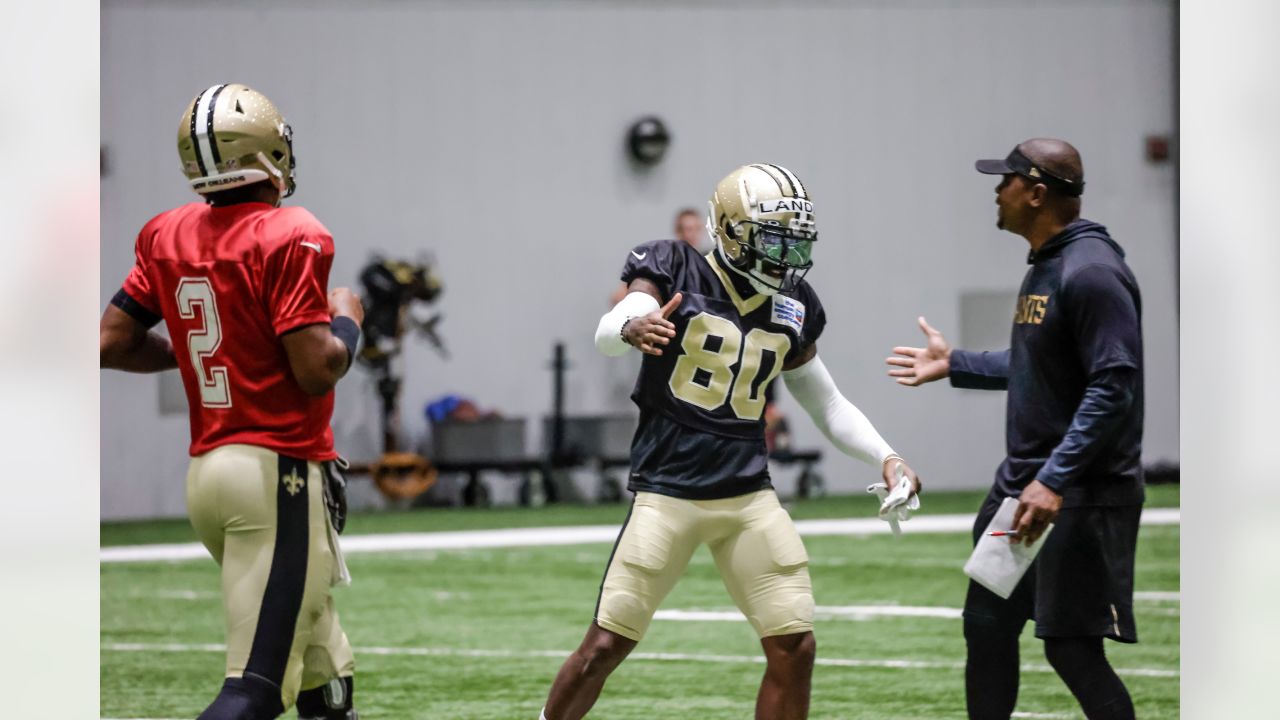 New Orleans Saints wide receiver Deonte Harty (11) wipes sweat from his  brow during training camp