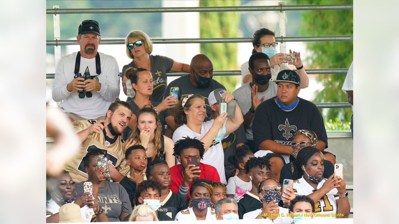 A New Orleans Saints fan waits for the start of practice during the Back  Together Weekend fan appreciation initiative at the NFL team's football  training camp in Metairie, La., Saturday, July 29