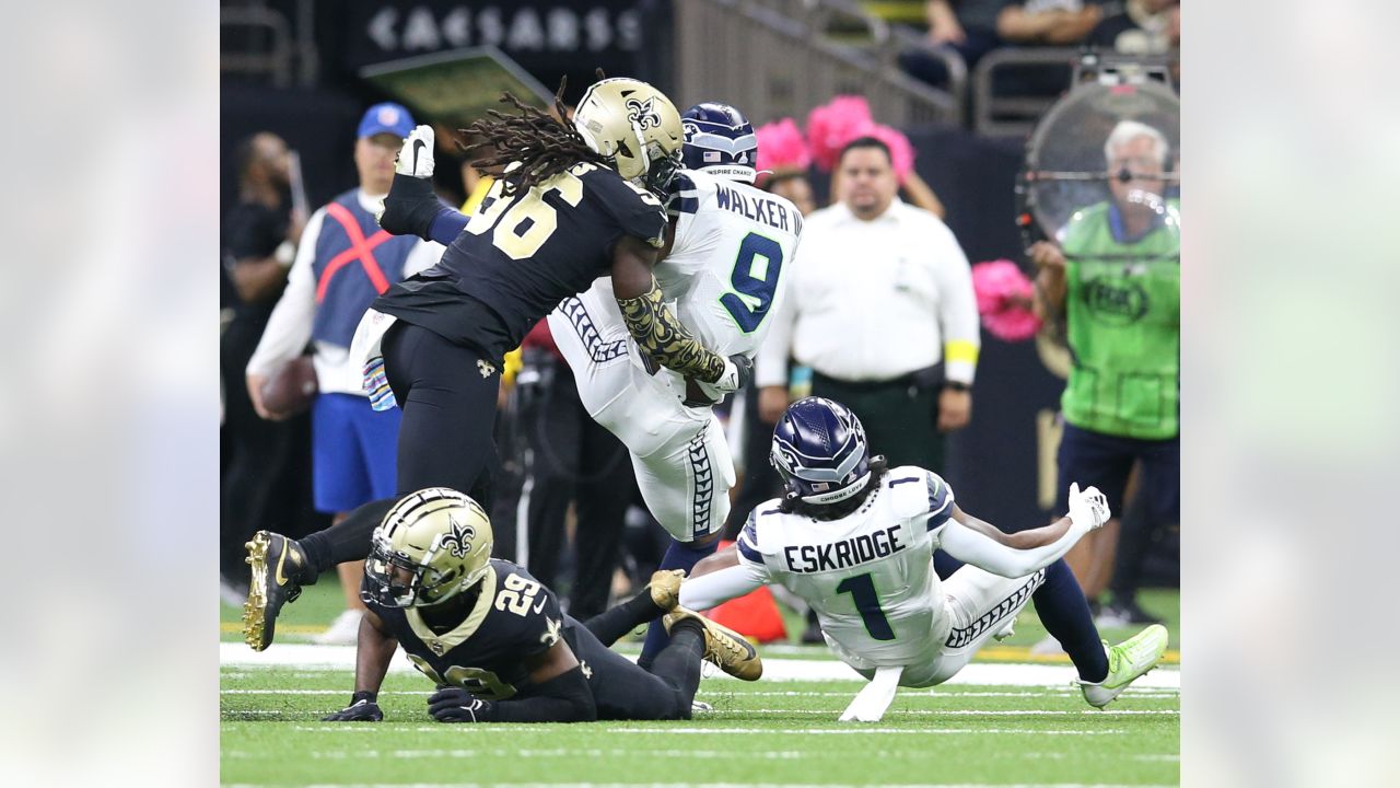 Taysom Hill New Orleans Saints Unsigned Carries the Ball in Black Jersey  Photograph