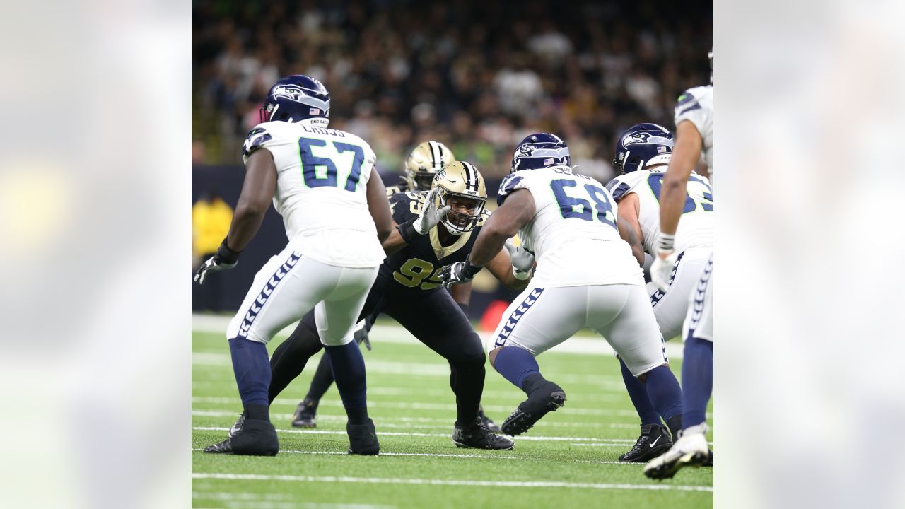 The referee performs the coin toss before an NFL football game between the  New Orleans Saints and the Seattle Seahawks in New Orleans, Sunday, Oct. 9,  2022. The Saints won 39-32. (AP