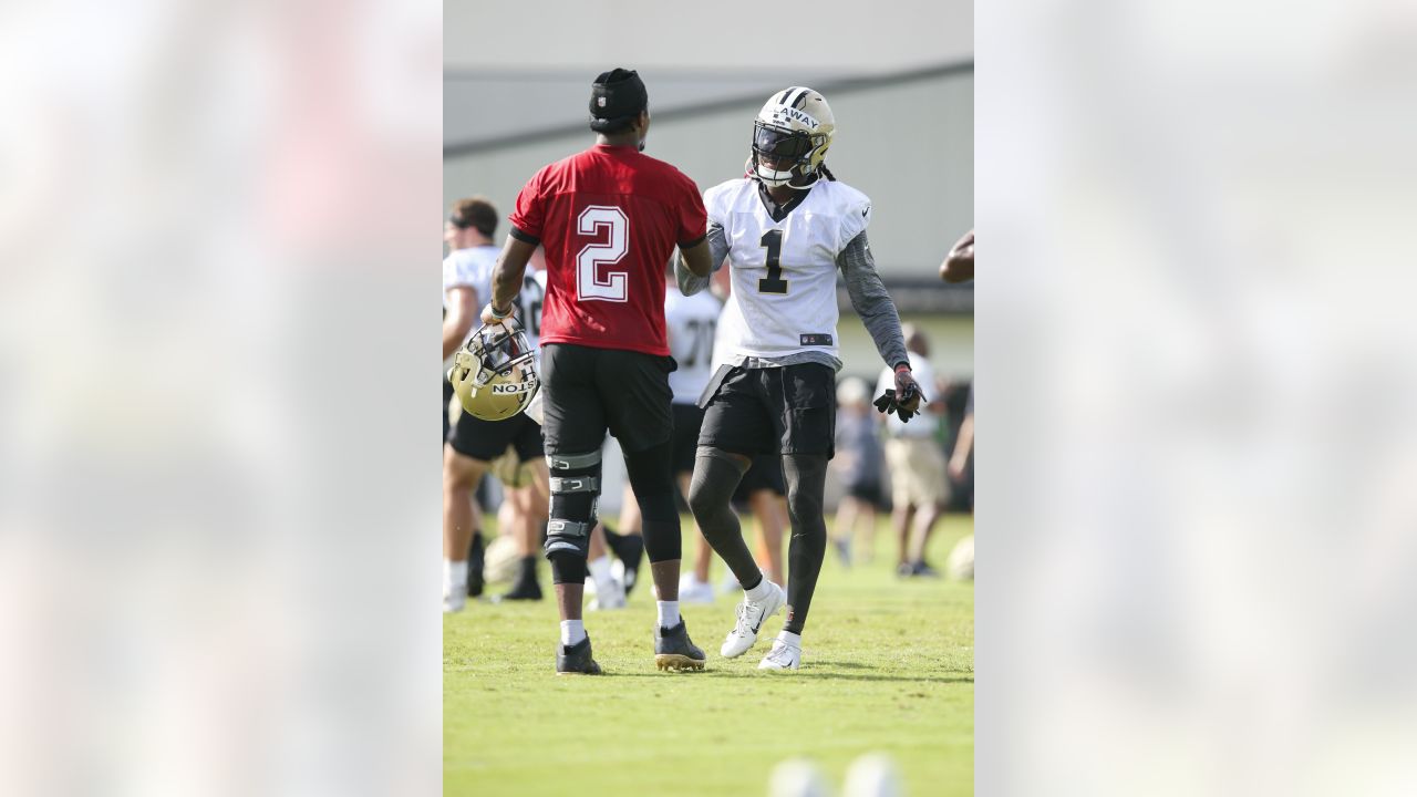 New Orleans Saints cornerback P.J. Williams (26) and quarterback Jameis  Winston (2) hug after an NFL