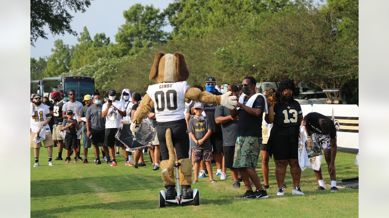 A New Orleans Saints fan waits for the start of practice during the Back  Together Weekend fan appreciation initiative at the NFL team's football  training camp in Metairie, La., Saturday, July 29