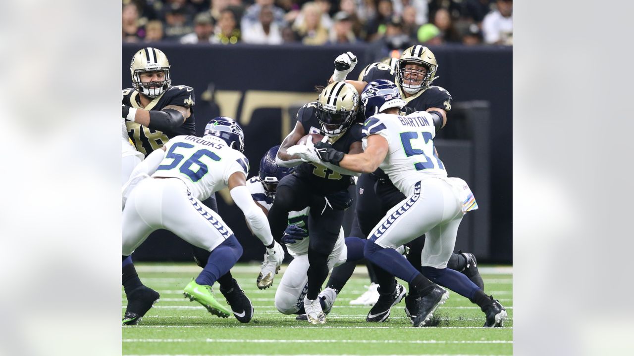 New Orleans Saints defensive end Cameron Jordan (94) celebrates after a  play during an NFL football game against the Seattle Seahawks, Sunday, Oct.  9, 2022, in New Orleans. (AP Photo/Tyler Kaufman Stock