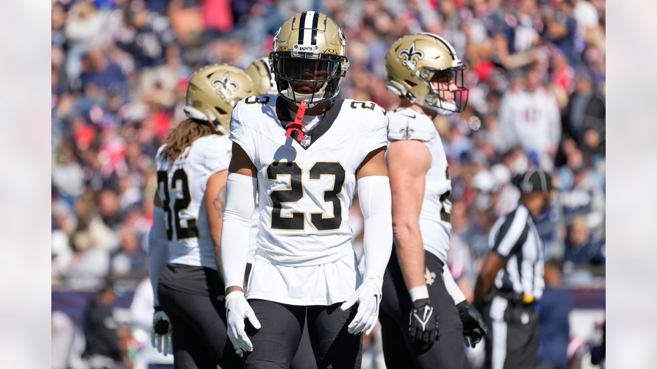 New England Patriots defensive tackle Carl Davis Jr. (98) is congratulated  by his teammates after recovering a fumble during an NFL football game  against the Cleveland Browns, Sunday, Oct. 16, 2022, in