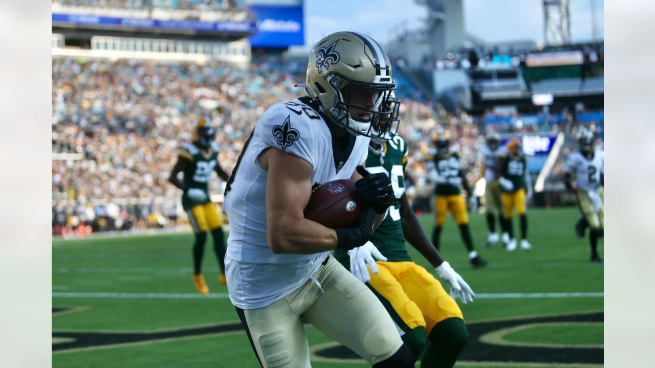 Green Bay Packers quarterback Danny Etling (19) runs for a touchdown during  an NFL Preseason game against the New Orleans Saints Friday, Aug. 19, 2022,  in Green Bay, Wis. (AP Photo/Jeffrey Phelps