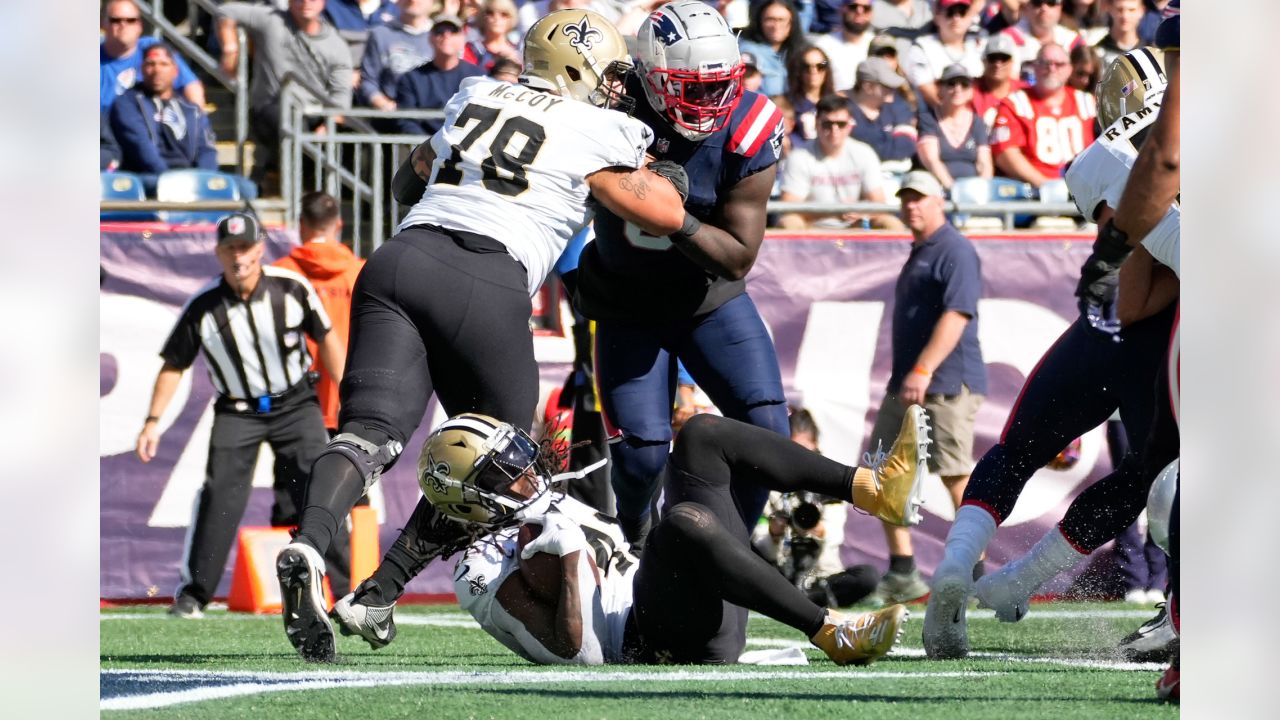 New England Patriots defensive tackle Carl Davis Jr. (98) is congratulated  by his teammates after recovering a fumble during an NFL football game  against the Cleveland Browns, Sunday, Oct. 16, 2022, in