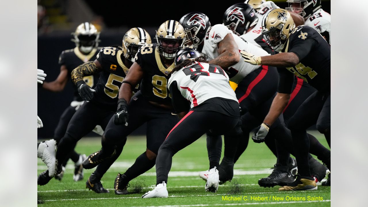 New Orleans, Louisiana, December 18, 2022. New Orleans Saints safety Justin  Evans (30) forces Atlanta Falcons wide receiver Drake London (5) into  fumbling the ball on a game-saving fourth down play late