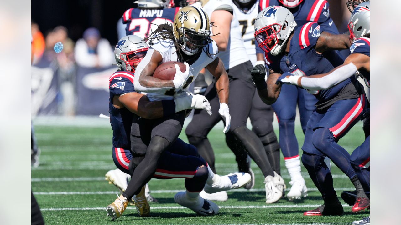 New England Patriots defensive tackle Carl Davis Jr. (98) is congratulated  by his teammates after recovering a fumble during an NFL football game  against the Cleveland Browns, Sunday, Oct. 16, 2022, in