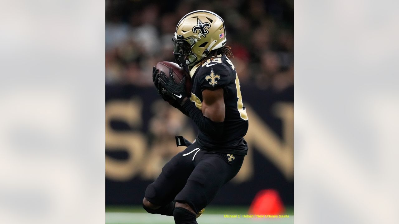 Taysom Hill New Orleans Saints Unsigned Carries the Ball in Black