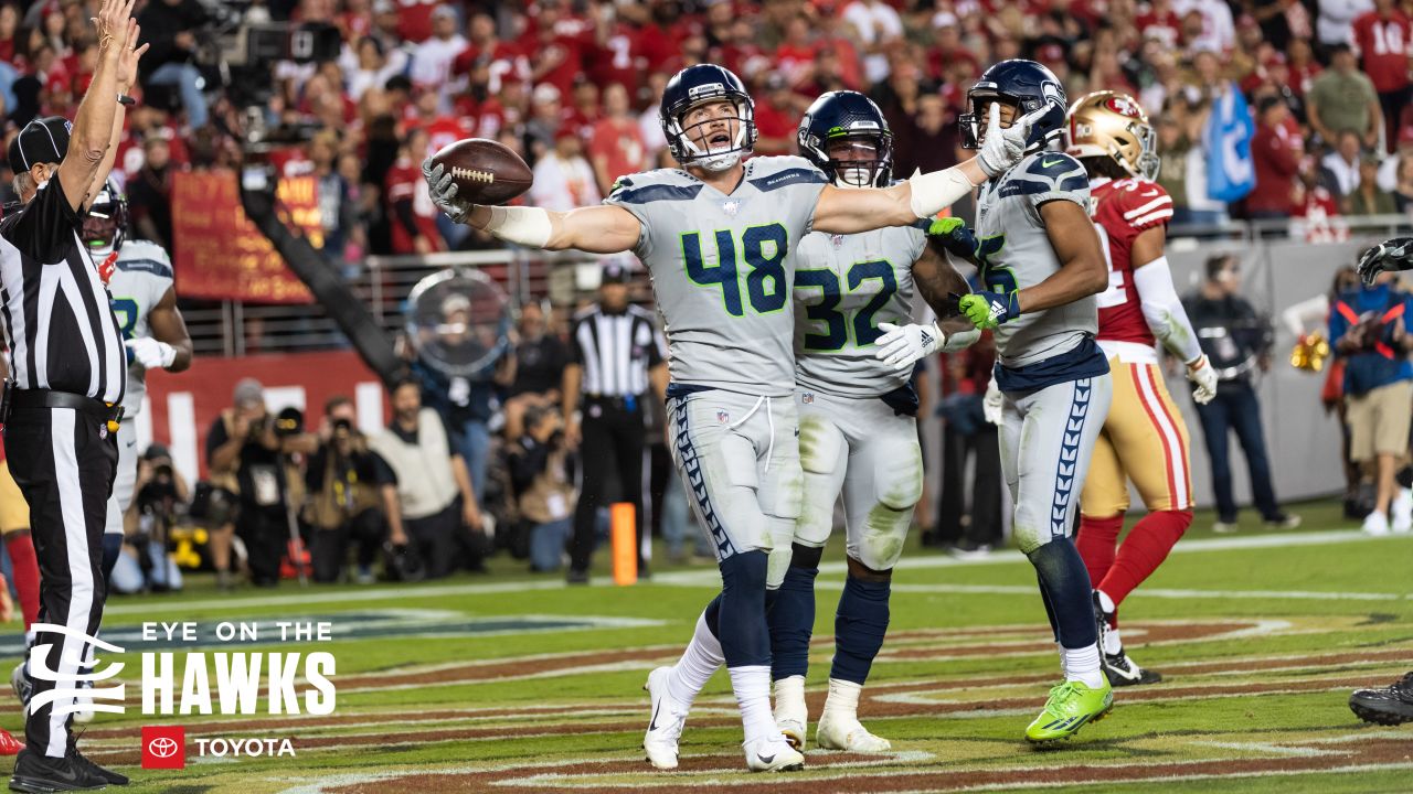 Seattle Seahawks tight end Jacob Hollister (48) scores a touchdown after a  reception as he is t …