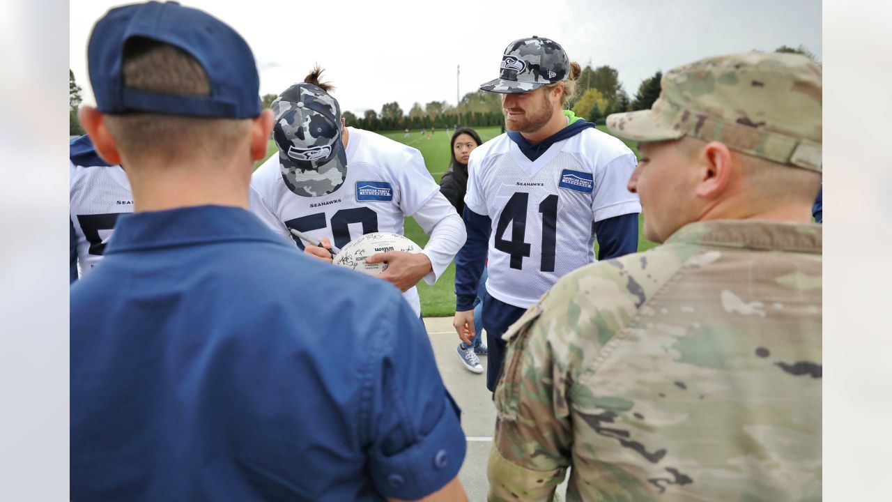 U.S. Military recruits are sworn in during halftime on Salute to Service  military appreciation day at an NFL football game between the Jacksonville  Jaguars and the Las Vegas Raiders, Sunday, Nov. 6