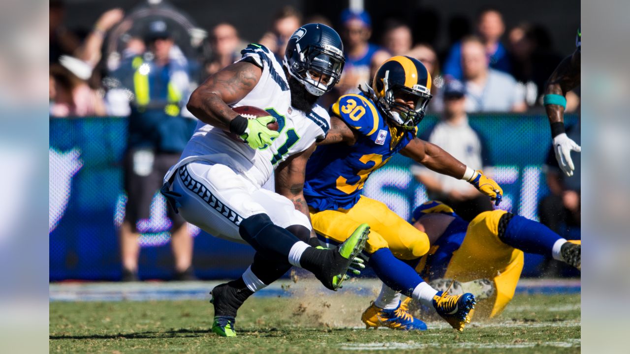 Seattle Seahawks defensive end Frank Clark (55) intercepts a pass intended  for Los Angeles Rams running back Todd Gurley (30) to stop a drive during  the first quarter at CenturyLink Field on