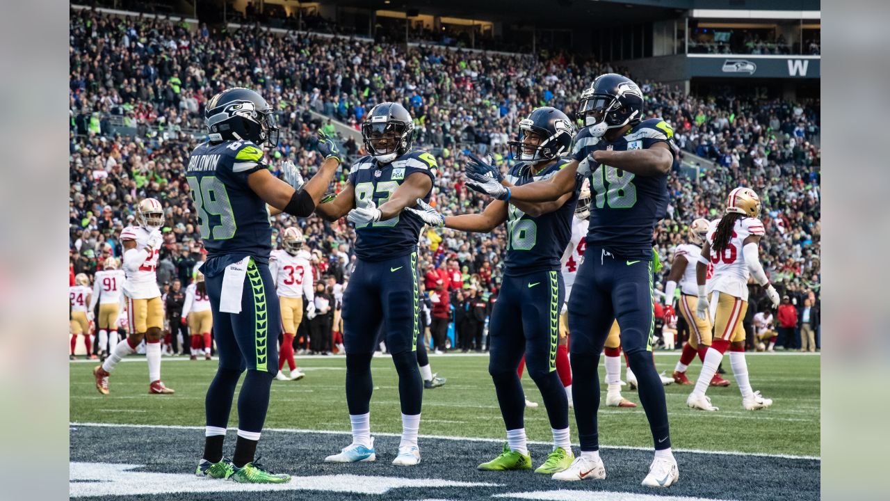 12s celebrate playoff-bound Seahawks after winning at Lumen Field Sunday