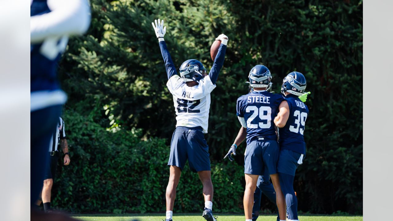 November 14, 2021: Seattle Seahawks safety Jamal Adams (33) and outside  linebacker Jordyn Brooks (56) tackle Green Bay Packers running back A.J.  Dillon (28) during the NFL football game between the Seattle