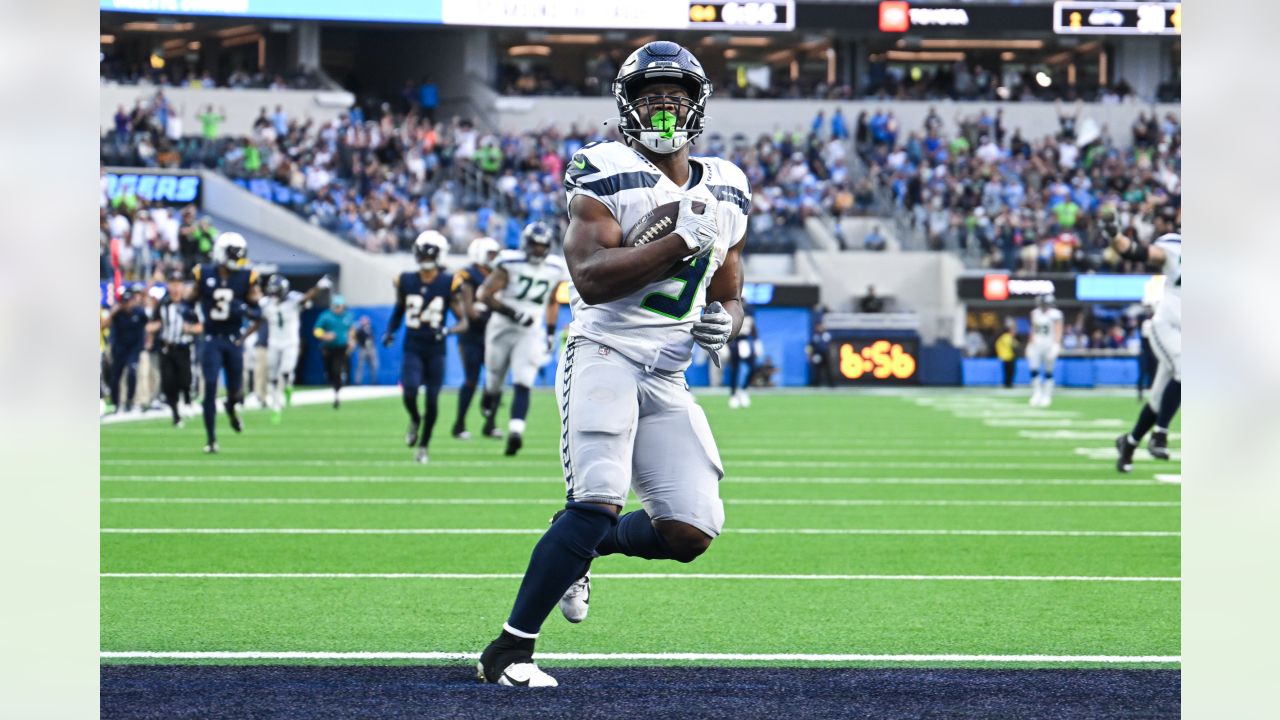 Los Angeles Chargers quarterback Justin Herbert (10) adjusts his helmet as  he warms up before an NFL football game against the Seattle Seahawks Sunday,  Oct. 23, 2022, in Inglewood, Calif. (AP Photo/Marcio