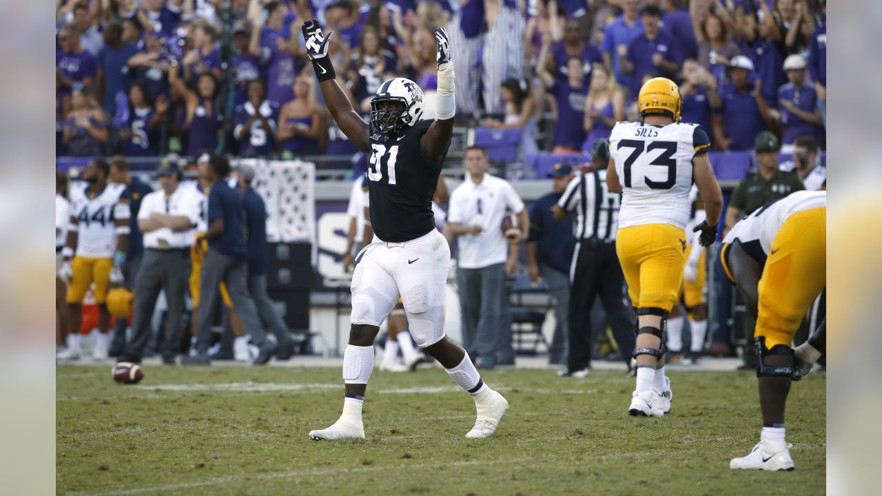 TCU defensive tackle L.J. Collier (91) celebrates as TCU plays West Virginia late in the fourth quarter of an NCAA college football game Saturday, Oct. 7, 2017, in Fort Worth, Texas. TCU won 31-24. (AP Photo/Ron Jenkins)