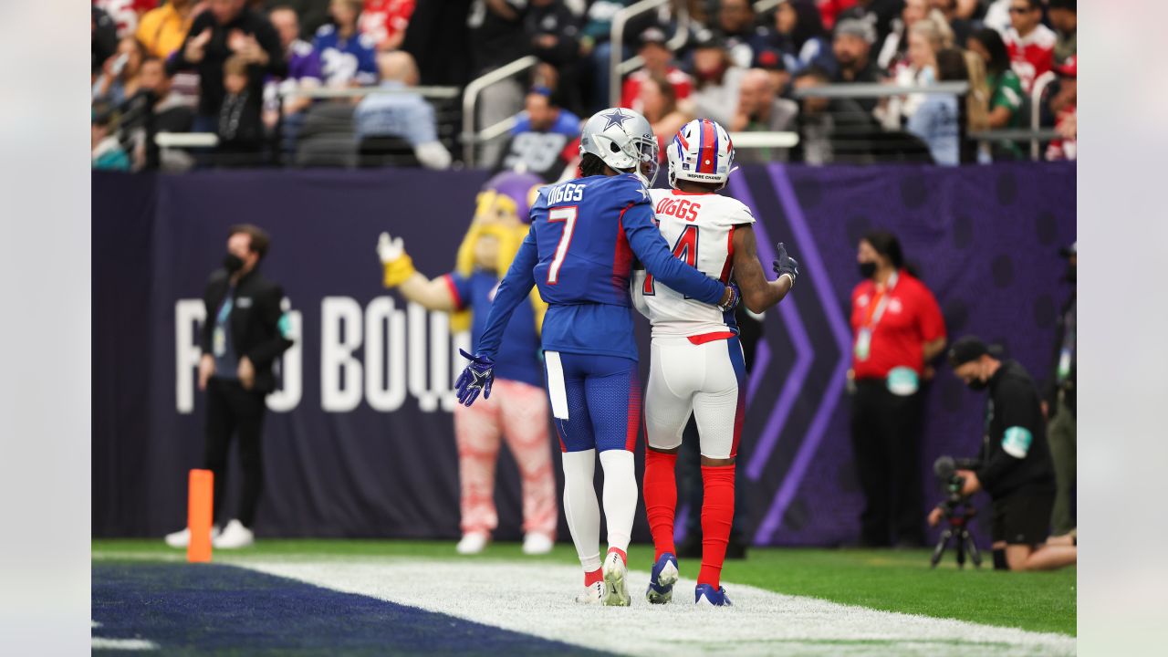 AFC wide receiver Stefon Diggs of the Buffalo Bills, left, and NFC  cornerback Trevon Diggs of the Dallas Cowboys pose with the jerseys each  player signed for the other after the AFC