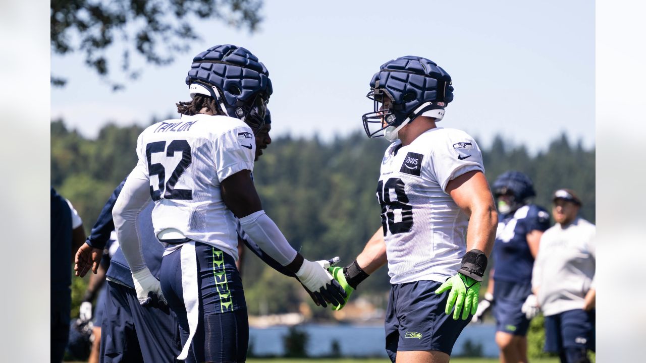 Seattle Seahawks linebacker Levi Bell (98), linebacker Boye Mafe (53), and  safety Jerrick Reed II (32) celebrate during an NFL pre-season football  game against the Minnesota Vikings, Thursday, Aug. 10, 2023 in