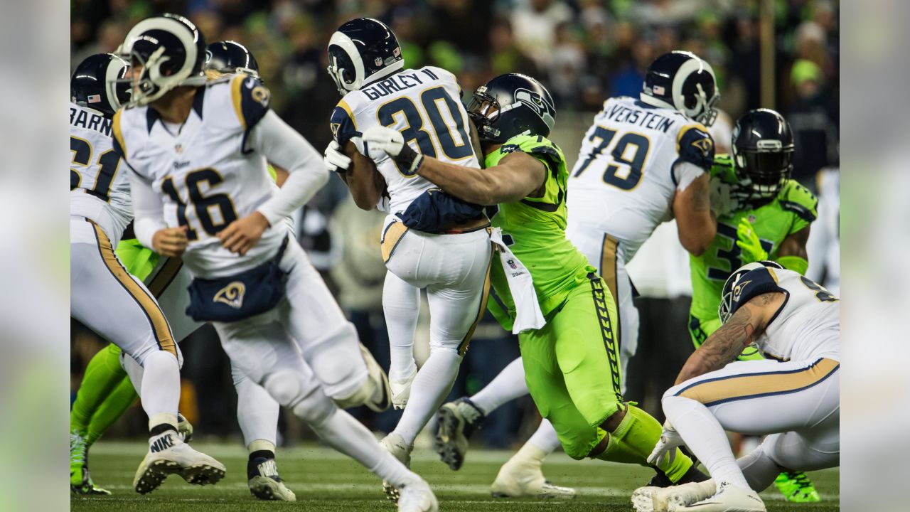 This Sept. 18, 2016 photo Los Angeles Rams' running back Todd Gurley, right  exchanges jersey's with Seattle Seahawks Tyler Lockett after an NFL  football game between the Los Angeles Rams and the