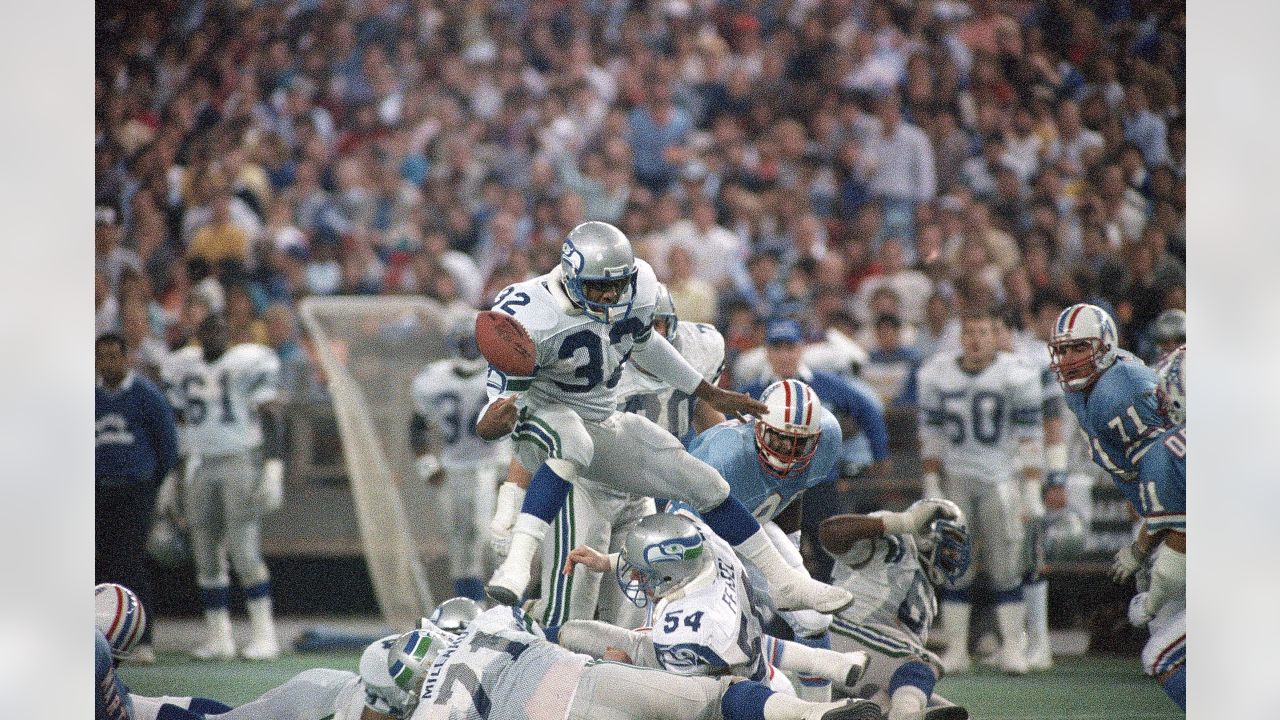 Seattle Seahawks John L. Williams (32) looses the ball as he tried jumping  over the line in the third quarter of the NFC playoff game in Houston,  Texas., Sunday, Jan. 4, 1988.