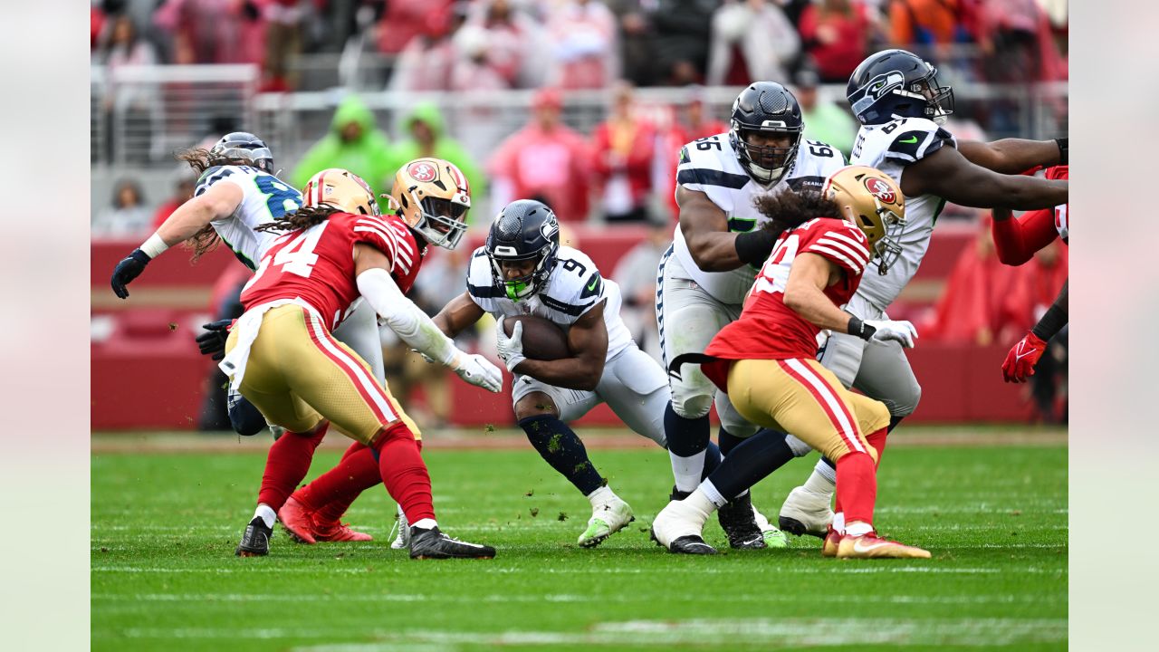 Seattle Seahawks wide receiver DK Metcalf (14) catches a touchdown against  San Francisco 49ers cornerback Charvarius Ward (7) during the first half of  an NFL wild card playoff football game in Santa