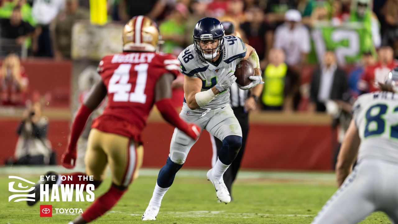 Seattle Seahawks tight end Jacob Hollister (48) scores a touchdown after a  reception as he is t …