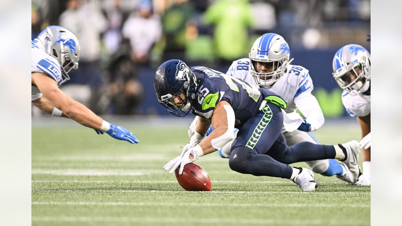 Seattle Seahawks quarterback Russell Wilson and wide receiver DK Metcalf  celebrate a touchdown during an NFL football game against the Detroit  Lions, Sunday, Jan. 2, 2022, in Seattle. The Seahawks won 51-29. (