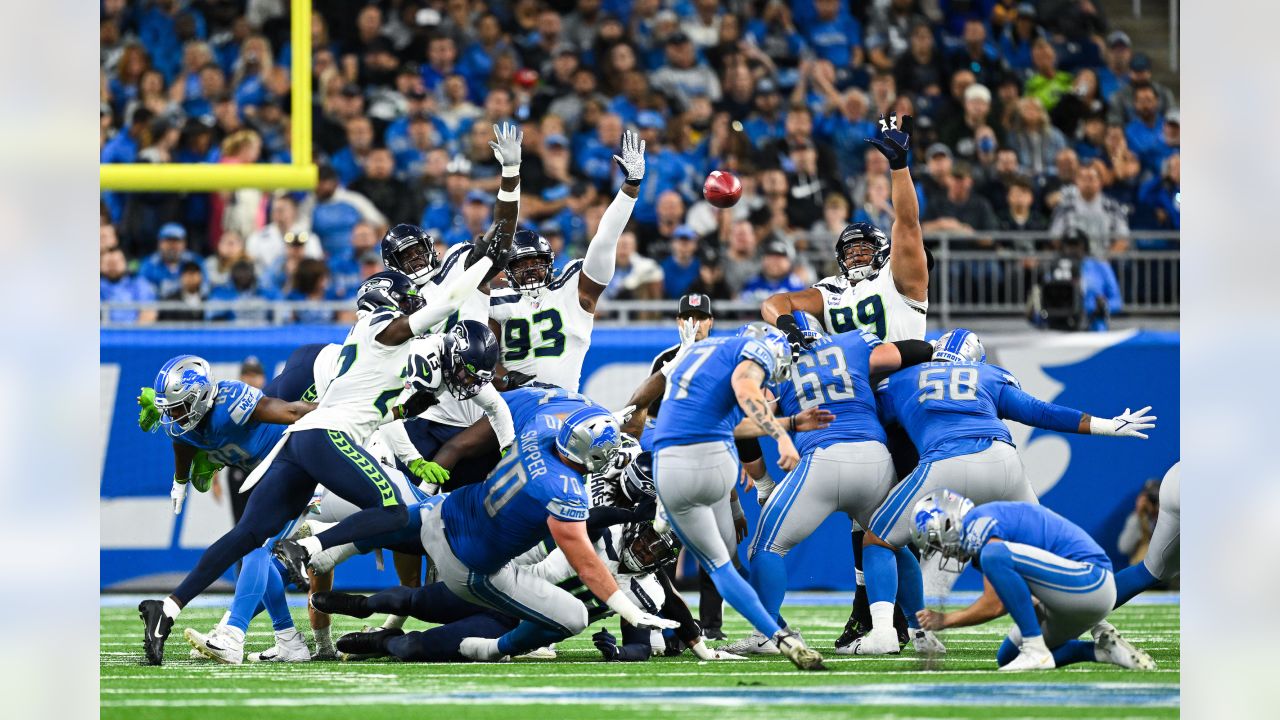 SEATTLE, WA - NOVEMBER 27: Seattle Seahawks defensive tackle Al Woods (99)  brings down Las Vegas Rai